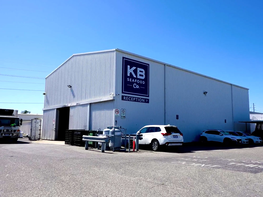 Big Building with the KB Seafood Co. logo on the side of it